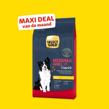 Zak Select Gold Medium Adult hondenvoer met kippen smaak, gelabeld "Maxi Deal van de maand" op gele achtergrond.
