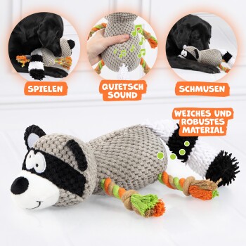 Ein Plüschspielzeug in Form eines Waschbärenhundes mit bunten Seilschwänzen und Sprechblasen für "SPIELEN," "QUIETSCH SOUND," und "SCHMUSEN." Weich und quietschend.