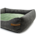 Ein plüschiges Haustierbett mit einem dunkelgrauen Äußeren und einem weichen grünen Kissen, mit einem braunen Etikett, das "RexProduct.com" liest.