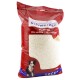 Sac rouge de riz soufflé pour animaux, étiqueté "schweizer Puffreis" avec une image d'un petit chien et "5 kg" en bas.