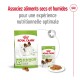 Emballage de nourriture pour chiens Royal Canin X-Small, présentant des croquettes sèches et des morceaux humides dans une sauce, avec un texte promouvant une nutrition optimale.