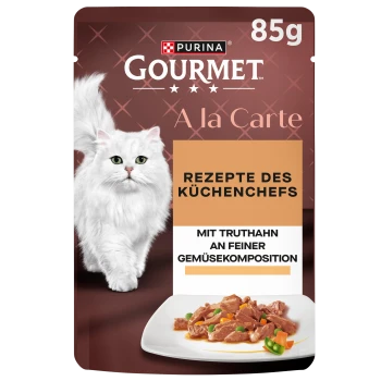 Purina Gourmet 85g kattenzakje met witte langharige kat en kalkoen met groenten; toont tekst "Recepten van de chef-kok".