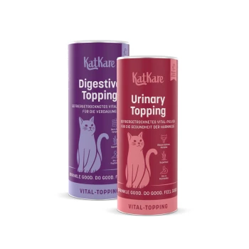 Zwei KatKare-Dosen: lila 'Digestive Topping' und rote 'Urinary Topping' für Katzen, mit Katzenillustration und 'Vital-Topping'-Text.