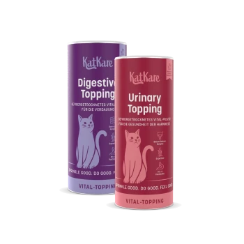 Zwei KatKare-Dosen: lila 'Digestive Topping' und rote 'Urinary Topping' für Katzen, mit Katzenillustration und 'Vital-Topping'-Text.