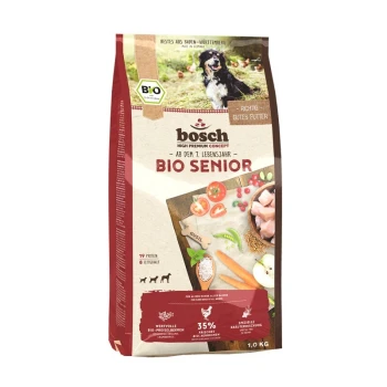 BIO Senior Hühnchen + Preiselbeere 1 kg Bosch Bio Senior Hundefutterpaket, 1,0 kg, mit einem schwarzen Hund auf der Vorderseite, mit Zutaten wie Huhn, Gemüse und Preiselbeeren.
