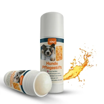 Hunde-Pflegestift mit einem niedlichen Welpenbild, beschriftet mit "Hunde Pflegestift" und "Dog Care Balm," mit einer Grafik von Waben.