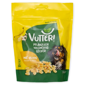 Gelb-grüne Tüte Vutter! vegane Hundesnacks mit Bananen- und Kokosgeschmack, mit einem Hund, der sich die Lippen leckt, und 110g Gewicht.