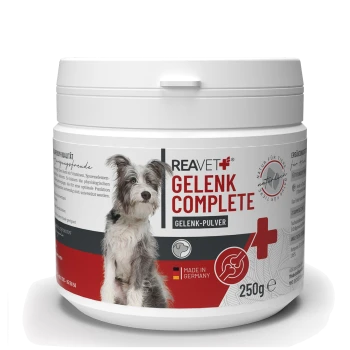 Behälter von REAVET Gelenk Complete, einem Gelenkergänzungspulver für Hunde, mit einem Hundebild, 'Hergestellt in Deutschland' und 250g Etikett.