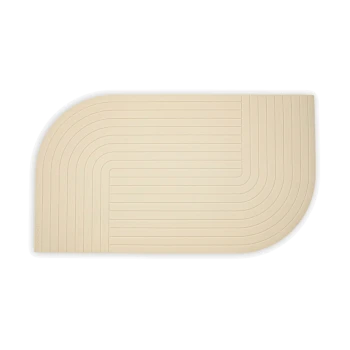 Beige Futtermatte für Haustiere mit einem strukturierten, geschwungenen Design und einem Linienmuster, ideal, um Futterbereiche sauber zu halten.
