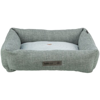 Graues Haustierbett mit einem weichen, runden Kissen mit Herzdesign, mit der Aufschrift "homeEdition" auf einem braunen Etikett.