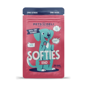 Emballage coloré de friandises pour chiens "Softies Rind" avec un chien de dessin animé et le texte : "Ideal fürs Training," "Sitz!," "High Five!," "Platz!"