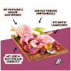 Rohe Lammstücke mit Pastinake, Kräutern und Öl auf Holzbrett; deutscher Text: "67% zartes Lammfleisch", "Nur eine tierische Proteinquelle".