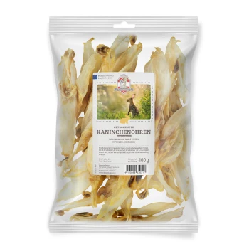Getrocknete Kaninchenohren in einer klaren Tüte, beschriftet mit 'GETROCKNETE KANINCHENOHREN', 400g, mit einem Kaninchenbild und Text, der die Einzelproteinquelle hervorhebt.