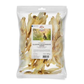 Suszone uszy królika w przezroczystej torbie, oznaczone "GETROCKNETE KANINCHENOHREN", 400g, z wizerunkiem królika i tekstem podkreślającym pojedyncze źródło białka.