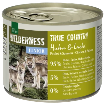 Canned "Wilderness True Country Junior" pet food with chicken, salmon, and playful wolf pups on the label. 95% meat, 5% fruits/herbs.