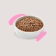A white bowl filled with small, brown pet food pellets, set against a light background with pink brushstroke accents.