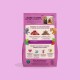 Sachet rose d'aliments pour chiens montrant des photos de deux chiens, illustration de viande et titre français « Quand les chiens dictent la recette ».