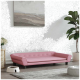 Ein stilvolles pinkes Haustiersofa mit Knopfdetails, platziert in einem modernen Wohnraum mit einer Topfpflanze und einer Futterschüssel für Haustiere.