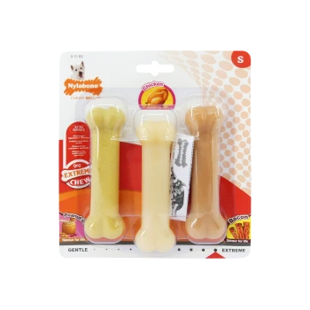 Three Nylabone chew toys in a pack: Peanut Butter, Chicken, and Bacon flavors, labeled "Extra Durable" and "Extreme Chew."