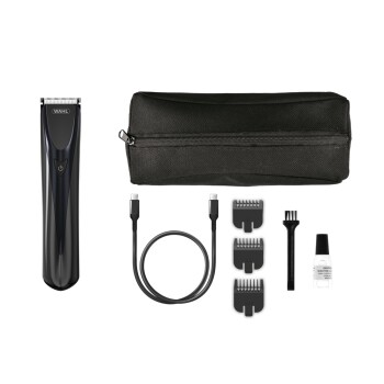 Wahl huisdierverzorgingsset met snoerloze tondeuse, drie opzetkammen, reinigingsborstel, olieflacon, USB-oplaadkabel en zwarte ritstas.