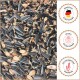 Gemischtes Vogelfutter mit Sonnenblumenkernen, beschriftet mit "Made in Germany", "Spezial für den Sommer" und "Aus hochwertigen Rohstoffen" auf Deutsch.