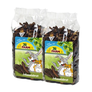 Deux sacs de JR FARM Johannisbrot, avec un lapin et un hamster de dessin animé sur l'étiquette, avec un fond vert et le texte "Frisch vom unserem Hof!"
