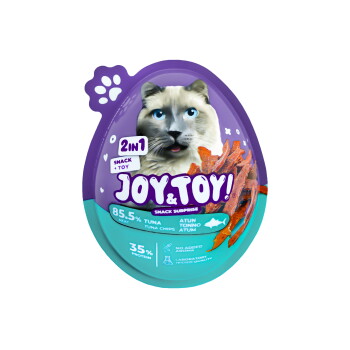 Lila-türkis eiförmige Haustiersnack-Verpackung mit Katzenmotiv, Aufschrift „JOY & TOY! 2in1 Snack + Toy“, „85,5 % Thunfisch“, „35 % Protein“.
