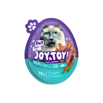 Lila-türkis eiförmige Haustiersnack-Verpackung mit Katzenmotiv, Aufschrift „JOY & TOY! 2in1 Snack + Toy“, „85,5 % Thunfisch“, „35 % Protein“.