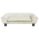Ein stilvolles, cremefarbenes Haustiersofa mit abgerundeten Armen, einem plüschigen Kissen und dekorativen Knöpfen, das auf schwarzen Beinen ruht.