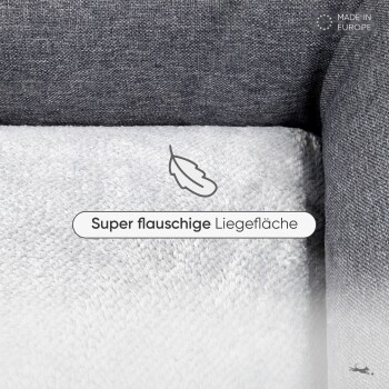Flauschiges Haustierbett mit dunkelgrauem Außenmaterial und weichem weißen Innenmaterial. Text: "Super flauschige Liegefläche."