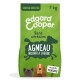 Sac de nourriture pour chiens de la marque Edgard Cooper, 7 kg, étiqueté "Sans céréales" et "Agneau nourri à l'herbe," avec des illustrations de chiens.
