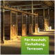Innenansicht eines Stalls mit hölzernen Pferdeställen, mit einer grünen Box mit weißem Text, die "Für Haushalt, Tierhaltung, Terrassen" liest.