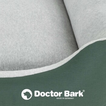 Graues Haustierbett mit grünem Rand, mit dem Logo "Doctor Bark" und dem Text "MADE IN GERMANY" am unteren Rand.