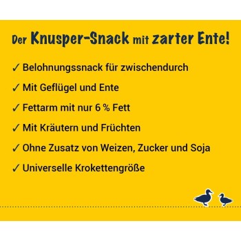 Josera-Logo auf einem gelben Abzeichen mit zwei grünen Bäumen, "CO2" in der Mitte und "KLIMANEUTRALE PRODUKTION" darunter.