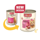 Twee blikken Animonda Carny Adult kattenvoer, Multimeat Cocktail smaak, met oud en nieuw ontwerp en een label "Nieuw Ontwerp".