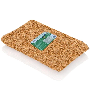 Eine Tüte mit natürlichem Haustierbett aus Holzspänen, mit einem grünen Etikett mit Produktinformationen und einer Vogelgrafik.