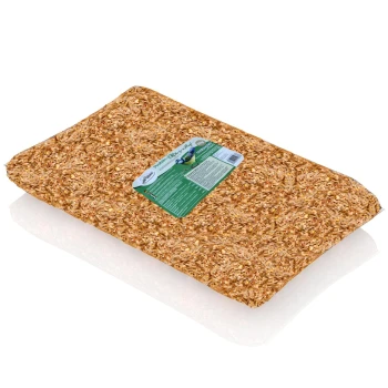Eine Tüte mit natürlichem Haustierbett aus Holzspänen, mit einem grünen Etikett mit Produktinformationen und einer Vogelgrafik.