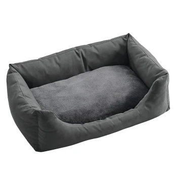 Graues Haustierbett mit weichem, plüschigem Innenraum und erhöhten Rändern, entworfen für Komfort und Unterstützung für Hunde oder Katzen.