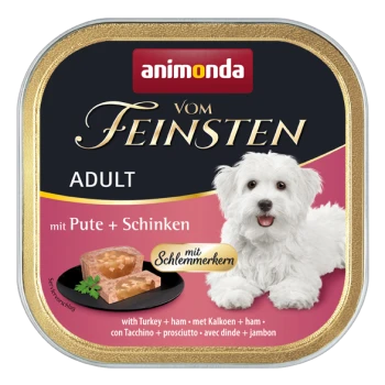 Puszka mokrej karmy dla psa z białym psem na etykiecie, z tekstem 'animonda vom Feinsten' i 'Adult mit Pute + Schinken'.