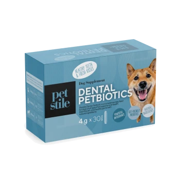 Blaue Schachtel des Pet Stile Dental Petbiotics Hundesupplements mit einem lächelnden Hund und Text, der gesunde Zähne und frische Küsse hervorhebt.