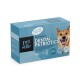 Blaue Schachtel des Pet Stile Dental Petbiotics Hundesupplements mit einem lächelnden Hund und Text, der gesunde Zähne und frische Küsse hervorhebt.