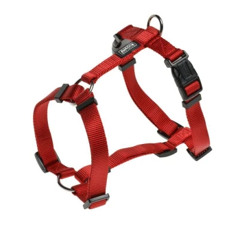 Red adjustable pet harness with black clips and D-ring for leash attachment, designed for comfort and security.