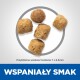 Pięć kawałków granulek na jasnym tle, oznaczone jako "Przybliżony rozmiar 7 x 6,5 mm" oraz "WSPANIAŁY SMAK" na niebiesko.