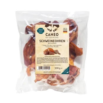 Getrocknete Schweineohren für Hunde in einer klaren Verpackung, beschriftet mit 'Caneo Schweineohren,' 300g, mit einem Wolf-Logo und '100% Naturprodukt.'
