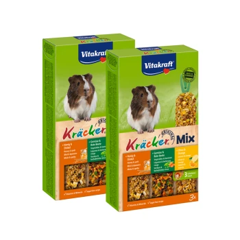 Zwei Boxen Vitakraft Kräcker Mix für Meerschweinchen, die ein Meerschweinchen und bunte Zutaten mit "Honig & Dinkel" und "Vitamine & Mineralien" zeigen.