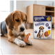 Beagle z gryzakiem obok opakowania przysmaków dla psów Premiere "I ♥ my dog" Meaties XXL.