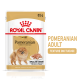Emballage de nourriture pour chien Royal Canin Pomeranian Adult, présentant une illustration de chien Pomeranian, taille 85 g, et un texte mettant en avant le soutien des os et des articulations.