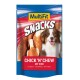 Un paquet de friandises pour animaux de compagnie coloré avec un chien souriant, étiqueté "MultiFit Snacks Chick 'N' Chew mit Rind" avec du bœuf.