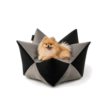 Stylisches Haustierbett in geometrischem Design, mit einer Mischung aus grauem und schwarzem, samtartigem Stoff.