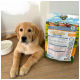 Ein Golden Retriever Welpe liegt neben einem Beutel Bellfor Premium Hundefutter mit der Aufschrift 'FREILAND-SCHMAUS JUNIOR', mit Nährwertinformationen.